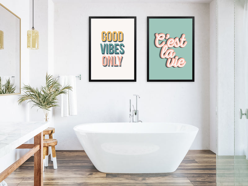 A collection of bathroom wall art prints in a bathroom setting with bath