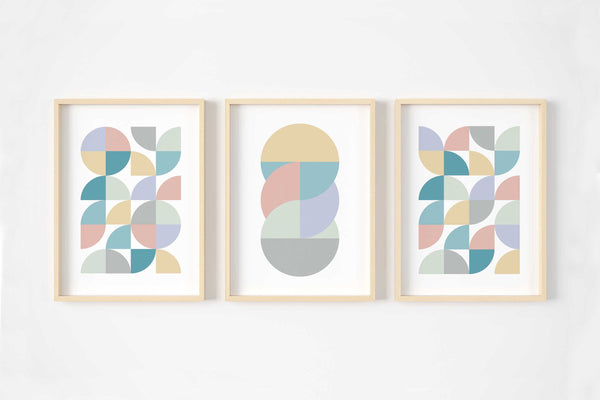 A set of three pastel abstract wall art prints in pinks, blues, yellows and greens